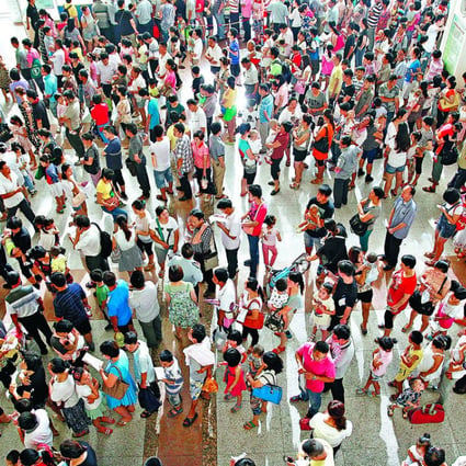 Parents face long queues as they wait to register their children at a top children’s hospital in Shanghai. Photo: Xinhua