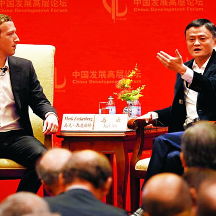 Mark Zuckerberg (left) founder of Facebook, listens to Jack Ma, founder of the Alibaba Group, during a discussion at Saturday’s China Development Forum in Beijing. Photo: AP