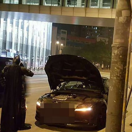 Batman was seen speaking on the phone when his batmobile broke down in Central. Photo: Facebook
