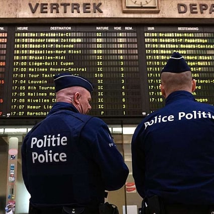 Policemen stand guard in grand central station in Brussels, after suicide bombing attacks of terrorists on March 22 in Zaventem airport and Brussels subway Maelbeek. Photo: AFP