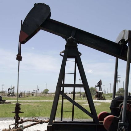 Oil pump jacks work in a field near Houston, Texas. Harris County has added more than 440,000 people since 2010 Photo: AP