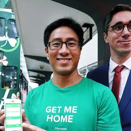 Citymapper’s Gene Soo (left) and Hong Kong Tramways’ Emmanuel Vivant demonstrate real-time tram data on the app. Photo: Jonathan Wong