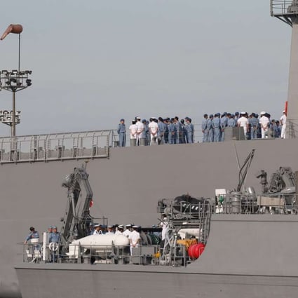 Navy officers assemble on board Japanese minesweeper class vessels. Photo: EPA