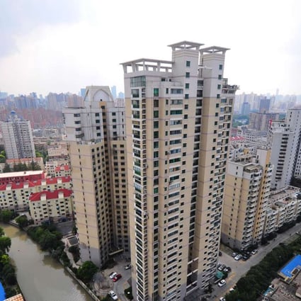 Shanghai home sales measured by floor area fell to 59,200 square metres overnight on Saturday, a day after new local government cooling policies were announced. Photo: Xinhua