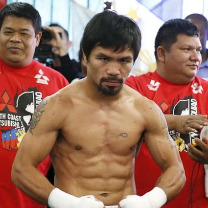 Manny Pacquiao, seen posing last month after a workout, was dropped by Nike following his comments. Photo: Reuters