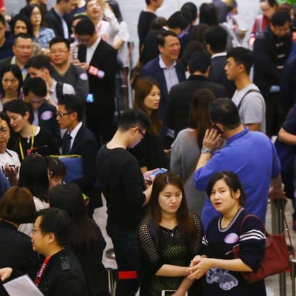 Potential buyers waiting outside sales office during Sun Hung Kai's Ocean Wings for sale at International Commerce Centre in West Kowloon. Photo: Edmond So