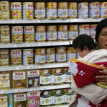 A file picture of a woman and baby shopping for milk powder in Beijing. Photo: Reuters