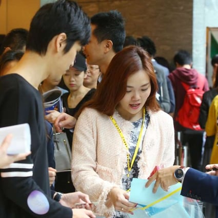 Potential home buyers gather during the sales of Sun Hung Kai's Ocean Wings at International Commerce Centre in West Kowloon. Photo: Edmond So