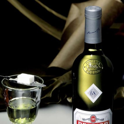 A bottle of Pernod absinthe.