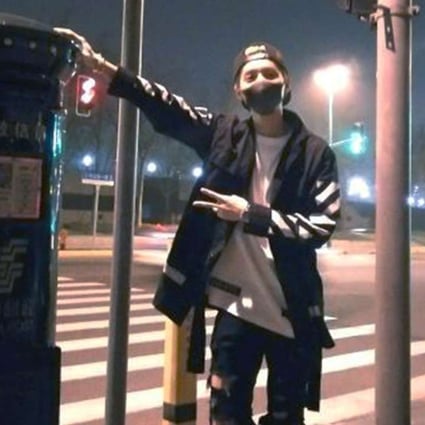 Chinese pop star Lu Han poses beside the mailbox on the Bund in Shanghai on Friday. Photo: SCMP Pictures