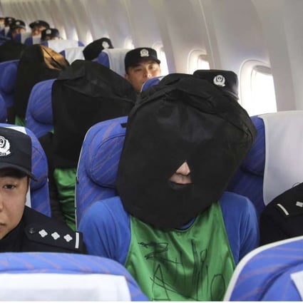 With the imagery of hooded detainees surrounded by Chinese police officers on board a plane, it is not surprising that the Taiwanese public and media talk about kidnapping. Photo: AP