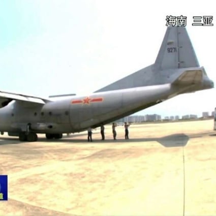 The Chinese military aircraft pictured at the airport at Sanya after transporting three critically ill construction workers from Fiery Cross Reef in the South China Sea. Photo: CCTV