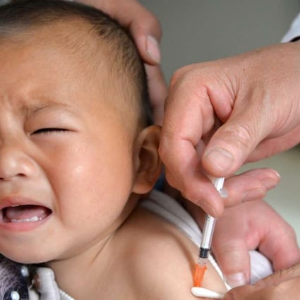 epa05228306 A picture made available on 24 March 2016 shows a child reacting to a vaccine shot against epidemic encephalitis B at a health station in Quzhou county,Hebei, China, 25 April 2015. Chinese police arrested 37 people allegedly responsible for the illegal distribution of improperly stored vaccines, worth almost 90 million US dollars, according to media reports. EPA/HAO QY CHINA OUT