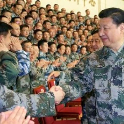 Xi Jinping wears a camouflage uniform at the PLA’s new joint operation command. File Photo