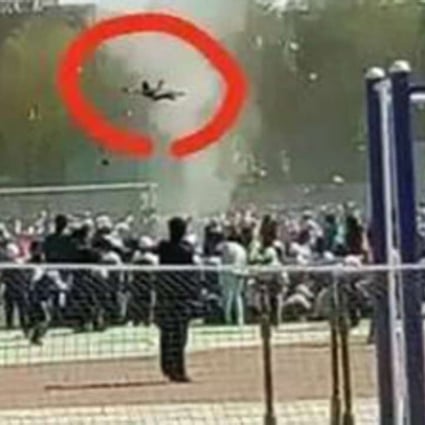 A photograph shows the mini tornado lifting primary school student Li Jiaqi into the air during his school’s sports day on Wednesday. Photo: Chinayouth.com