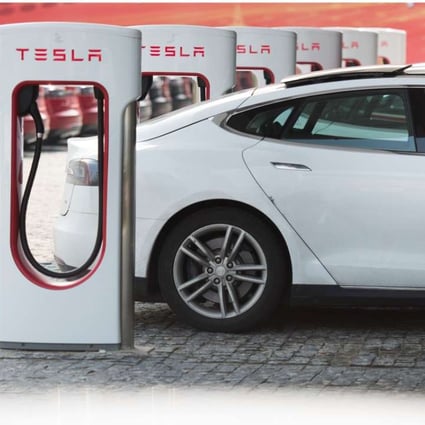 Tesla electric cars are being charged at a car dealership in Shanghai. Photo: AFP
