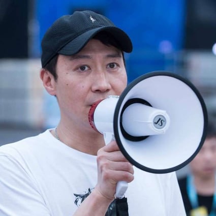 The Canto-pop idol was at the scene with a hand-held megaphone to announce the concert was cancelled and apologised for his team not meeting safety standards. Photo: Robert Ng