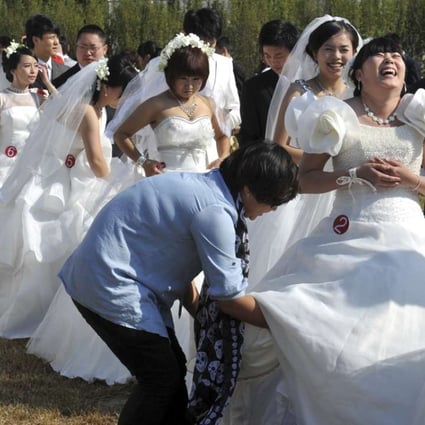 A mass wedding in Beijing. The number of Hong Kong women marrying Chinese men rose more than fivefold between 1991 and 2013. Photo: AFP