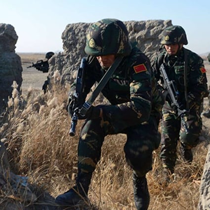 PLA troops take part in a live-fire drill in northeast China. The CMC has dispatched teams to assess training standards. Photo: SCMP Pictures