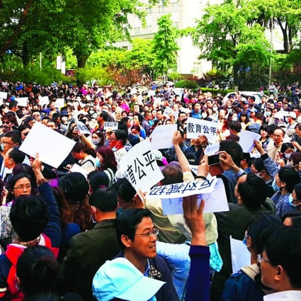 Parents in Nanjing, the capital of Jiangsu province, protest on Saturday against a new policy that allows more non-locals into top universities. Photo: ImagineChina