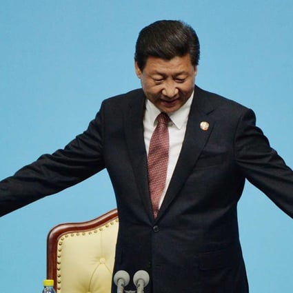 CORRECTION: REMOVE REFERENCES TO POOL Chinese President Xi Jinping gestures at the closing press conference of the fourth Conference on Interaction and Confidence Building Measures in Asia (CICA) summit at the Expo Center in Shanghai on May 21, 2014. AFP PHOTO/ Mark RALSTON