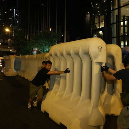 Water barriers were used to cordon off restricted areas. Photo: Sam Tsang