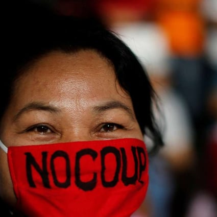 An anti-coup demonstrator takes part in a march in Bangkok as Thailand marks two years since the army toppled the elected government of former Prime Minister Yingluck Shinawatra. Photo: Reuters