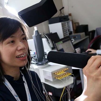 Karen Yu Ka-man demonstrates the Articulograph, a device used by speech therapists. Photo: Dickson Lee