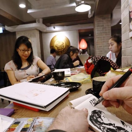 Participants in the group sketch meet-ups draw each other’s faces. Photos: Jonathan Wong