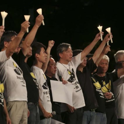 Members of the Hong Kong Alliance in Support of Patriotic Democratic Movements of China hold candles at the vigil in Victoria Park in 2015. Photo: Felix Wong