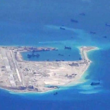 Chinese dredging vessels are purportedly seen in the waters around Fiery Cross Reef in the disputed Spratly Islands in the South China Sea. Photo: Reuters