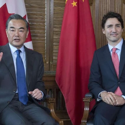 China’s Foreign Minister Wang Yi pictured with Prime Minister Justin Trudeau during his trip to Canada. Photo: AP