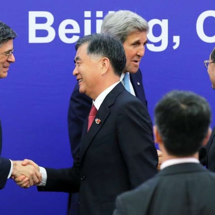 US Treasury Secretary Jack Lew (left), US Secretary of State John Kerry (centre back), China’s Vice-Premier Wang Yang (centre front) and China’s State Councillor Yang Jiechi greet each other after the closing ceremony of the US-China Strategic and Economic Dialogue in Beijing. Photo: Reuters
