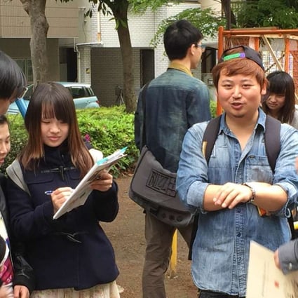 Chinese and Japanese people meet at a Hanyu Jiao (or Chinese chat) session at a park in Tokyo’s bustling Ikebukuro district. Photo: Kyodo