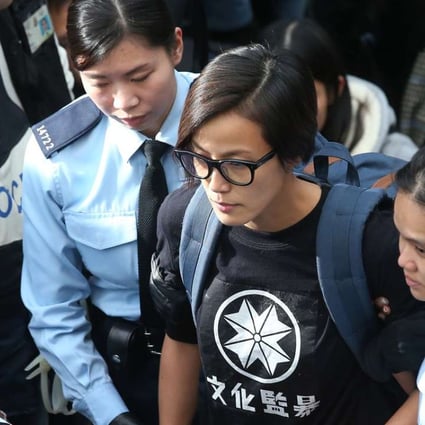Denise Ho was taken away by police officers while barricades were removed and tents torn down at the end of Occupy Central in Admiralty. Photo: K. Y. Cheng
