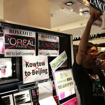 Protesters outside a Lancome booth in Times Square. Photo: Sam Tsang