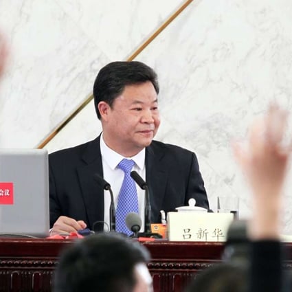 Lu Xinhua speaks to the media at a press conference at the Great Hall of the People in Beijing before the 12th CPPCC in March, 2015. Photo: Simon Song