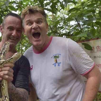 Karl Davies felt able to relax after Dave Willott (left) caught the Burmese python which had sunk its teeth into Davies’ leg two days earlier and tried to grip the 107kg Hong Kong resident in its coils. Photos: Red Door News