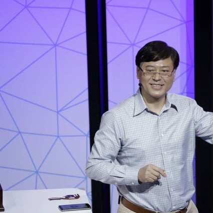 Lenovo Chairman and CEO Yuanqing Yang holds up the new Phab2 Pro phone during the keynote address at the Lenovo Tech World event on June 9, 2016 in San Francisco. Photo: AP