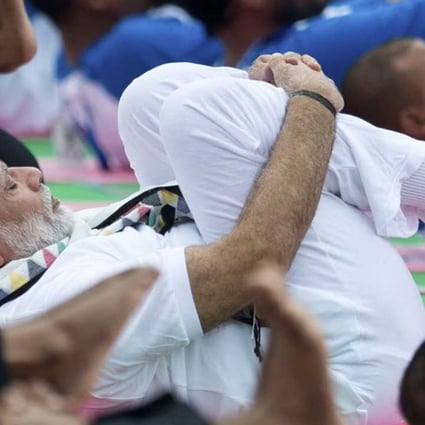 India’s Prime Minister Narendra Modi performs yoga in Chandigarh on Tuesday to mark the second International Yoga Day. Photo: AP