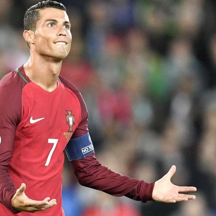 WATCH: Cristiano Ronaldo chucks reporter’s microphone into a lake at ...