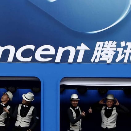 Entertainers perform underneath a Tencent logo at the Global Mobile Internet Conference in Beijing in 2014. Photo: Kim Kyung-Hoon, Reuters