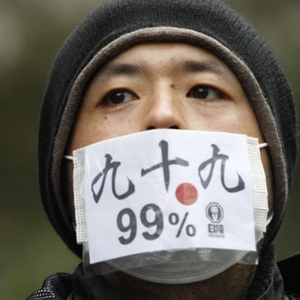 A protester in Tokyo joins a rally in 2011 against bankers, financiers and politicians they accuse of ruining global economies. Today, globalisation is driven not only by trade, finance and people, but also by digital information. Photo: Reuters