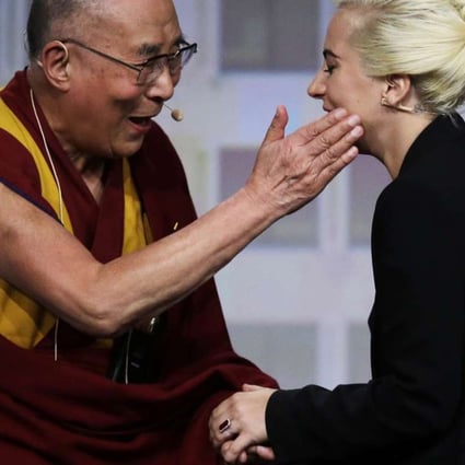 The Dalai Lama (left) greets Lady Gaga before they hold a question-and-answer session at the US Conference of Mayors in Indianapolis on Sunday. Photo: AP