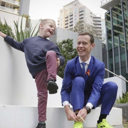Mike Tozer, 35, and his son Josiah, five, who suffers from the genetic condition Fragile X, in Sydney. Photo: Daniel Marr