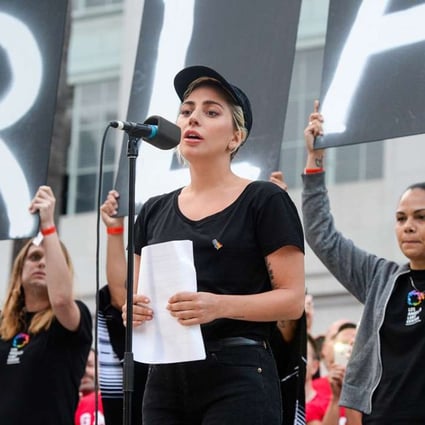 Lady Gaga reads some of the names of the victims at Los Angeles City Hall on June 13. Photo: AP