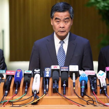 Leung (centre) meeting the press at government headquarters in Tamar on Wednesday. Photo: Sam Tsang