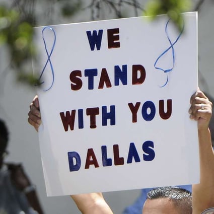 People attend an interfaith prayer event for the victims of the mass shooting that killed five police officers and wounded seven others, during a protest over recent police shootings in Minnesota and Louisiana, in Dallas, on July 8, 2016. Photo: TNS