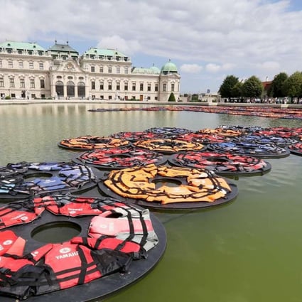 Chinese artist Ai Weiwei’s installation F Lotus, made of life vests floating on the pond at Vienna’s Belvedere Palace. Photo: AP