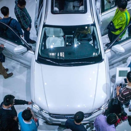 People gather at the Haval stand at the Beijing Auto Show in Beijing on April 27, 2016. SUVs accounted for 34.9 per cent of China’s personal vehicle market in the first half of the year. Photo: AFP